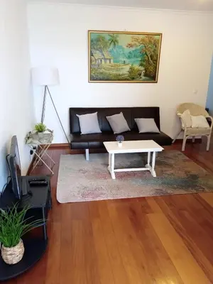 a living room with a couch and a coffee table at Aroma do Mar in Caniço