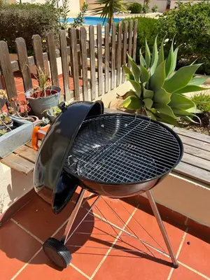 a grill sitting on top of a patio at Casa Lobitos Holiday Home with Pool - Sagres in Sagres