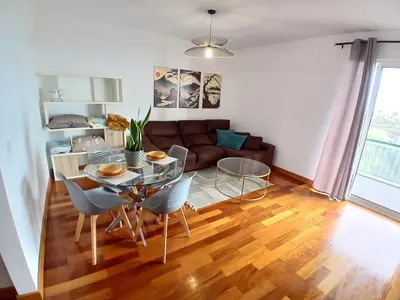 a living room with a table and a couch at Al-Solares in Santa Cruz