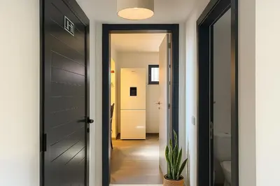 a bathroom with a shower and a sink and a mirror at Casa Joao Batista em Machico in Machico