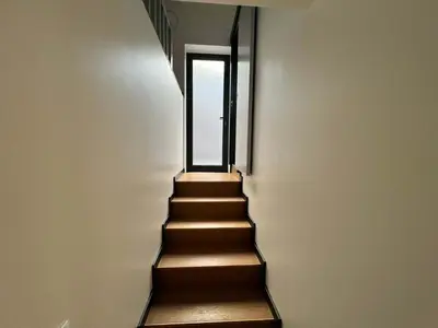 a stairway leading up to a door with a window at Casa Joao Batista em Machico in Machico