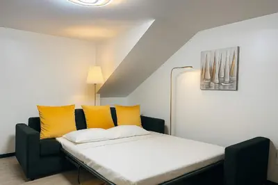 a living room with two couches and a flat screen tv at Casa Joao Batista em Machico in Machico