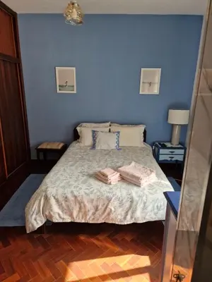 a bedroom with a bed with two towels on it at Nature Brava Stay in Ribeira Brava