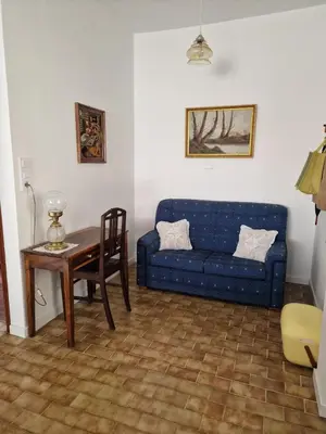 a patio with chairs and a table on a patio at Nature Brava Stay in Ribeira Brava