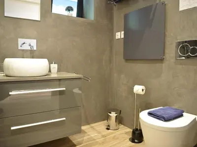 a bathroom with a sink and a toilet in it at Quinta Golfinho - Villa Palmeira in Arco da Calheta