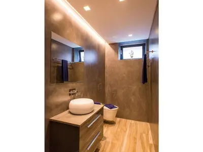 a bathroom with a sink and a toilet in it at Quinta Golfinho - Villa Rosa in Arco da Calheta