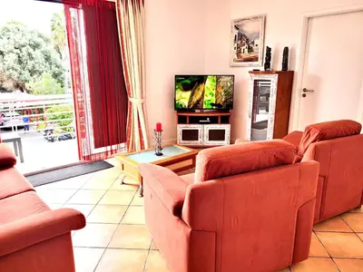 a living room with two couches and a tv at SeaView in Porto Santo