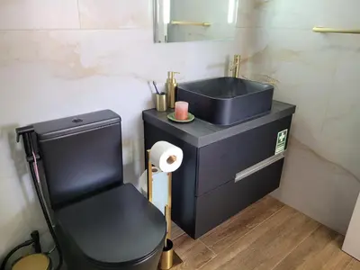 a small bathroom with a sink and a toilet at SeaView in Porto Santo