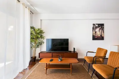 a living room with a tv and a coffee table at GuestReady – Madeira escape with ocean view in Funchal