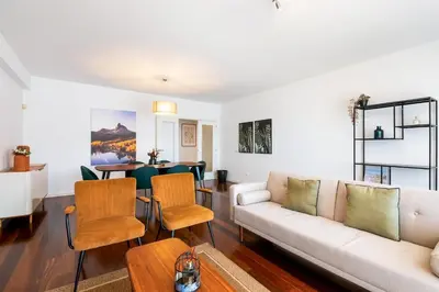 a living room with a couch and a table at GuestReady – Madeira escape with ocean view in Funchal