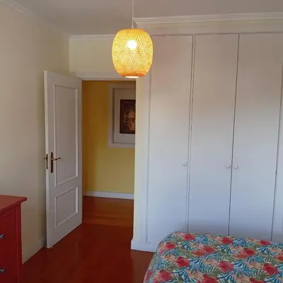 a room with two windows and a door with a view at Apartamento Silvestre Freitas in Funchal
