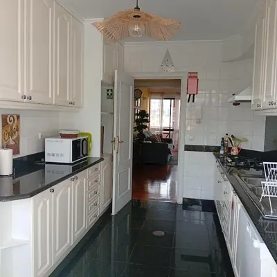 a bathroom with a sink and a mirror at Apartamento Silvestre Freitas in Funchal