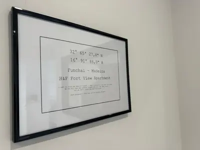 a picture of a framed picture on a wall at H&F Fort View Apartment in Funchal