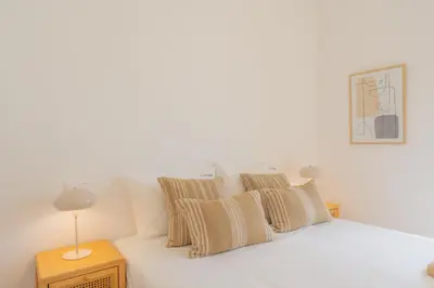 a bedroom with a white bed with pillows at FLH Ocean View Escape at Acqua Residences in Funchal