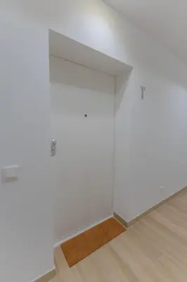 an empty room with white walls and a wooden floor at FLH Ocean View Escape at Acqua Residences in Funchal