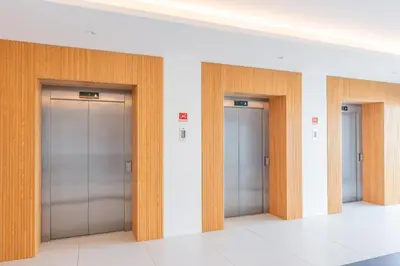 a row of elevator doors in a building at FLH Ocean View Escape at Acqua Residences in Funchal