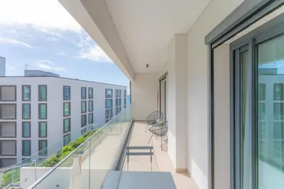 a balcony with a view of a building at FLH Ocean View Escape at Acqua Residences in Funchal