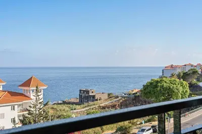 a view of the ocean from a balcony at Atlantic Paradise in Caniço