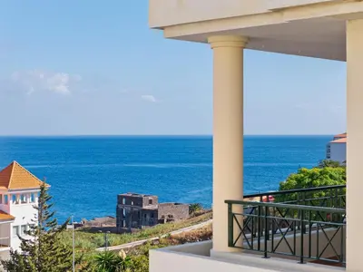 a view of the ocean from the balcony of a house at Atlantic Paradise in Caniço