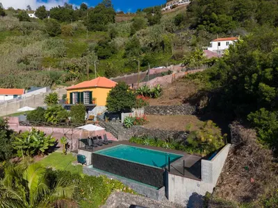 an aerial view of a house with a swimming pool at Casa da Laranja by Holiday Rental Madeira in Tábua