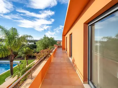 a balcony with a view of a pool at Contemporary villa with private pool #1987 in Lagos