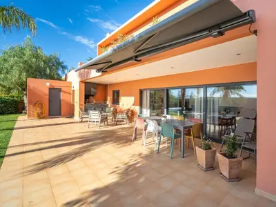 a patio with a table and chairs on it at Contemporary villa with private pool #1987 in Lagos
