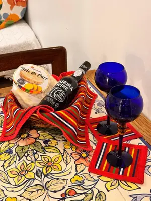 a table with two blue glasses on a bed at Mango Tree House Funchal Madeira Island in Funchal
