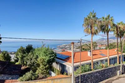 a view of the ocean from a building at Funchal Hills, a Home in Madeira in Funchal