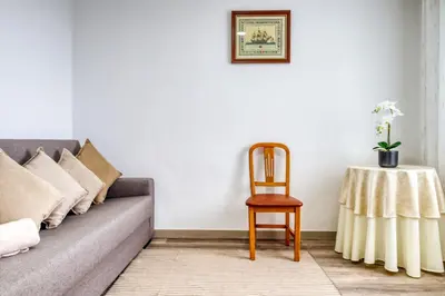 a living room with a couch and a table at Funchal Hills, a Home in Madeira in Funchal