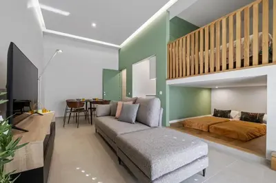 a living room with a couch and a bed at Studio Palace B by Homie in Funchal