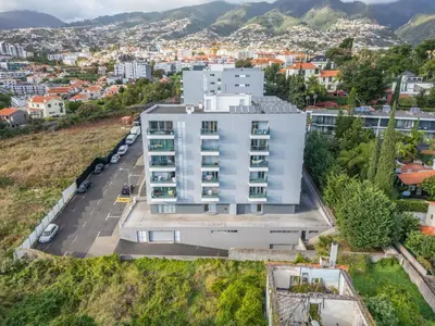 an aerial view of a white building in a city at Studio Palace B by Homie in Funchal