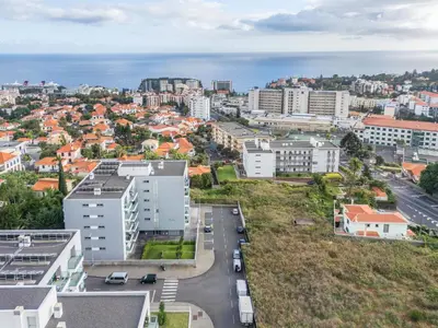 an aerial view of a city with buildings and the ocean at Studio Palace B by Homie in Funchal