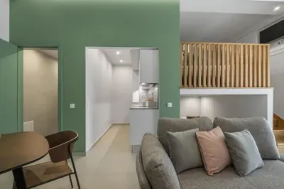 a living room with a couch and a table at Studio Palace B by Homie in Funchal