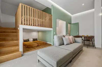 a bedroom with a bed and a couch in a room at Studio Palace A by Homie in Funchal