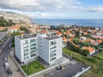 an aerial view of a white building in a city at Studio Palace A by Homie in Funchal