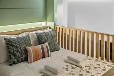 a bed with pillows on it in a bedroom at Studio Palace A by Homie in Funchal