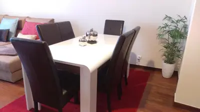 a white dining room table with black chairs at Enchanting and cozy ACHADA PALACE APARTMENT in Funchal