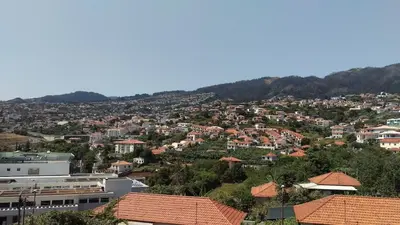 a view of a city with houses and mountains at Enchanting and cozy ACHADA PALACE APARTMENT in Funchal