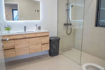 a bathroom with a sink and a mirror at A View to Paradise – Spectacular Sea & Bay Views in Funchal