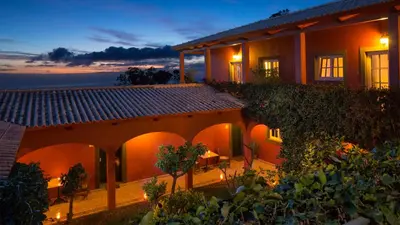 a house with a garden at night at Atrio in Estreito da Calheta