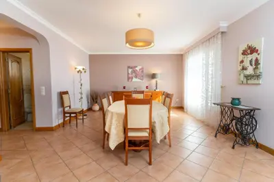 a kitchen and dining room with a table and chairs at Casa Do Dino in Ribeira Brava