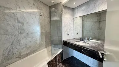 a bathroom with a sink and a shower at Forum Sky in Funchal