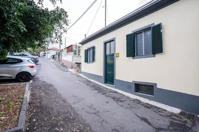 a street with a car parked next to a building at CITY OASlS FUNCHAL APARTMENT & STUDIO in Funchal