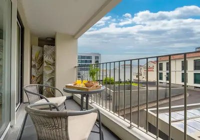 a city with a cruise ship in the water at Funcho 91, cozy apartment in the heart of the city in Funchal