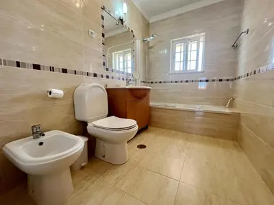 a bathroom with a toilet and a sink and a tub at V4 moderno com Piscina - Burgau in Burgau