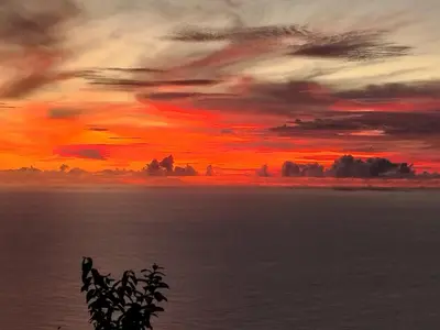 a sunset over a body of water at Beautiful View - Arco da Calheta - Ilha da Madeira in Arco da Calheta
