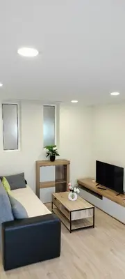 a living room with a couch and a tv at Beautiful View - Arco da Calheta - Ilha da Madeira in Arco da Calheta