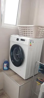 a white washing machine sitting on a shelf at Beautiful View - Arco da Calheta - Ilha da Madeira in Arco da Calheta