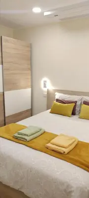 a bedroom with a bed with two towels on it at Beautiful View - Arco da Calheta - Ilha da Madeira in Arco da Calheta