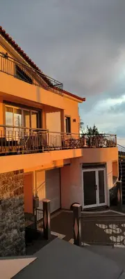 a large house with a balcony on top of it at Beautiful View - Arco da Calheta - Ilha da Madeira in Arco da Calheta